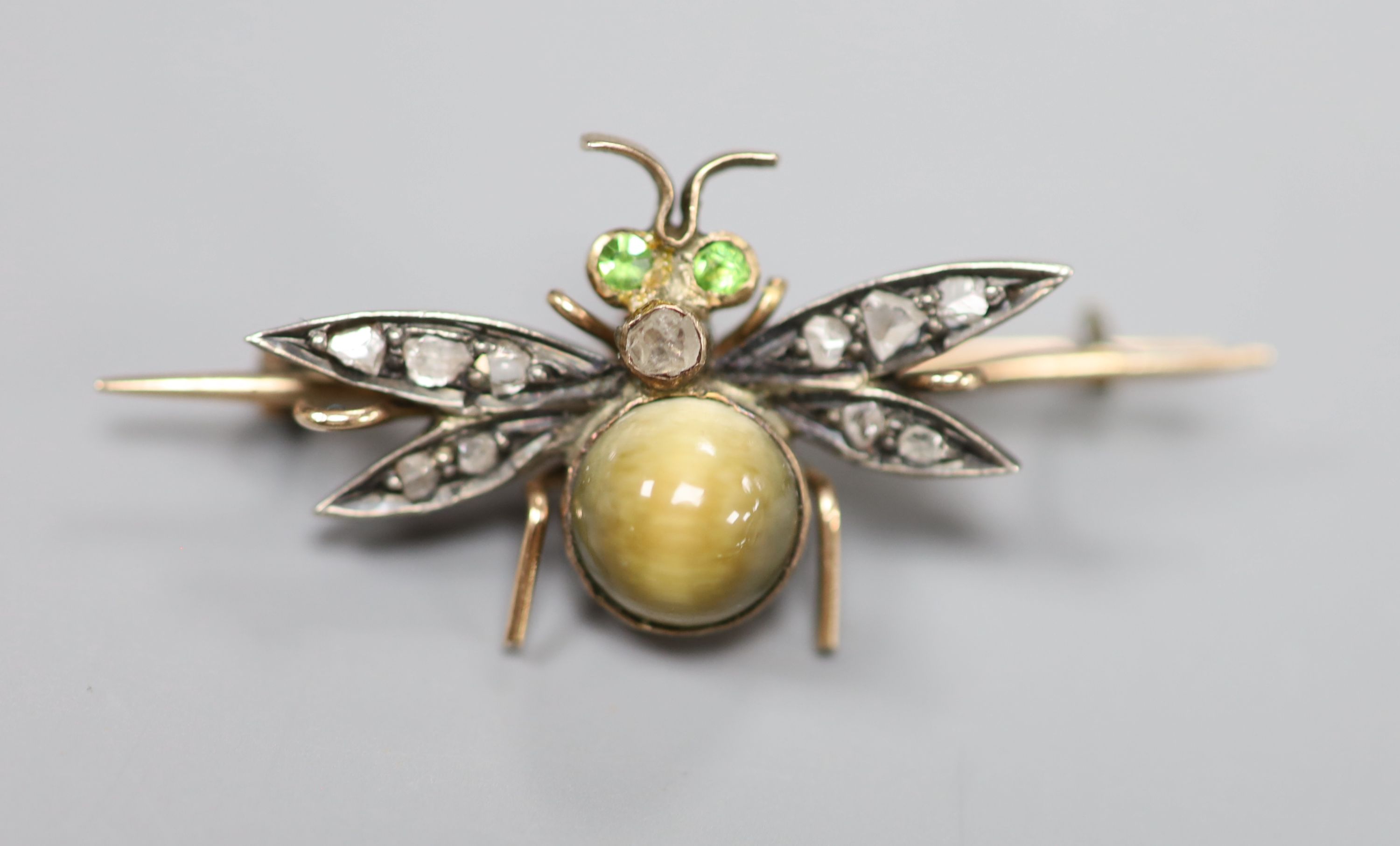 A Victorian yellow metal cats eye quartz?, garnet and rose cut diamond set bug brooch, overall 36mm, gross 2.5 grams.